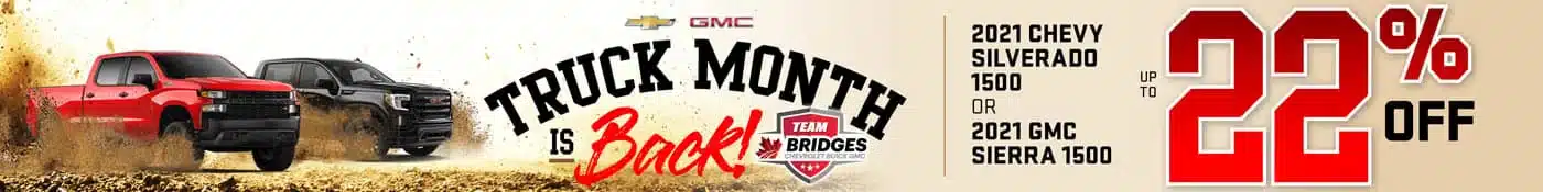 Advertisement banner for GMC Truck Month, featuring a red Chevrolet Silverado and a black GMC Sierra on a sandy terrain. Text highlights up to 22% off 2021 Chevy Silverado 1500 or 2021 GMC Sierra 1500.
