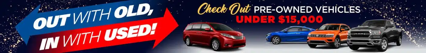 A banner advertising pre-owned vehicles under $15,000. It features a red minivan, a blue sedan, and a gray pickup truck on a dark background with a red and blue arrow that says, Out with Old, In with Used!.