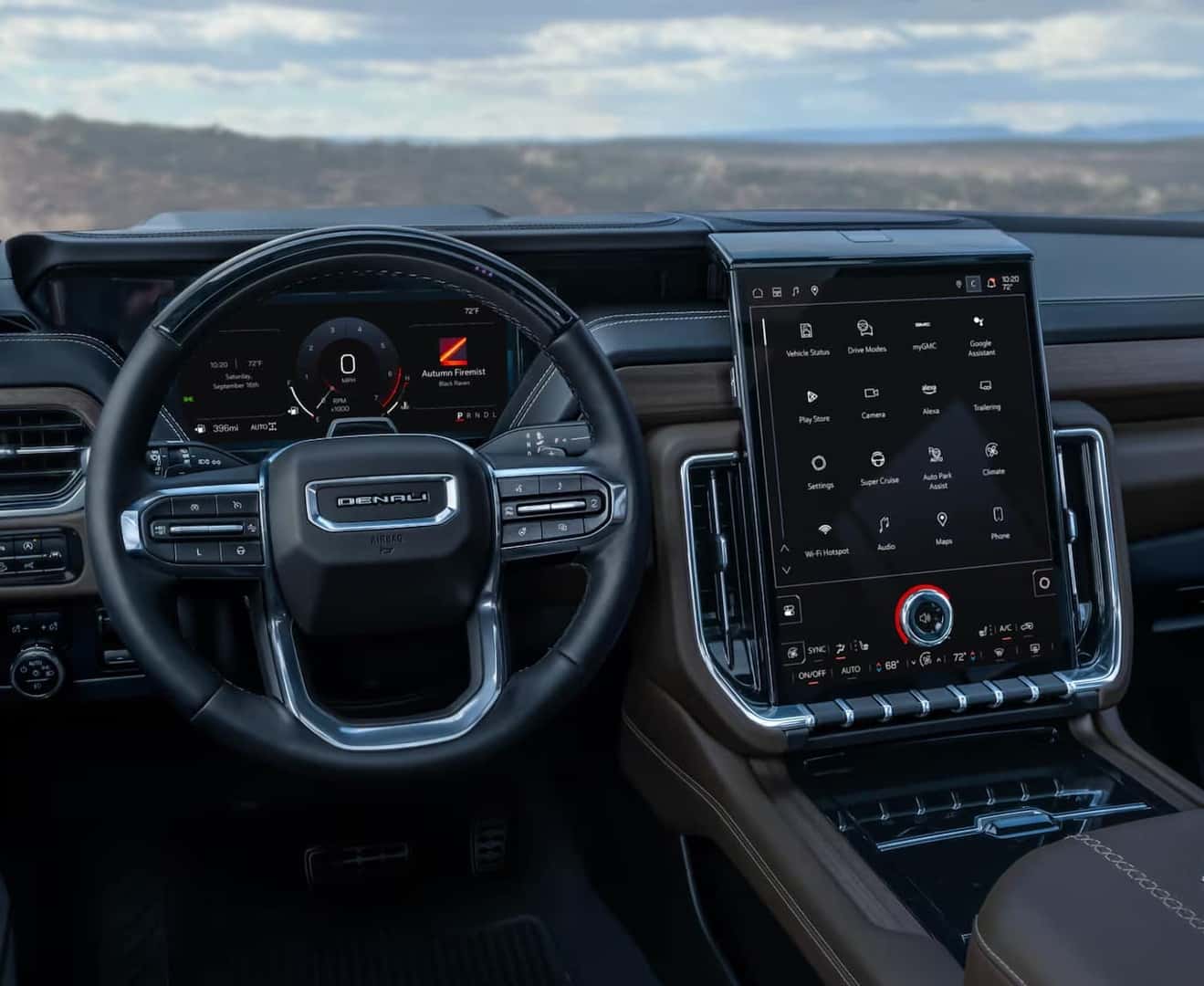 The image shows a modern car interior featuring a steering wheel with multiple controls and a large, vertical touchscreen in the center console displaying various apps and settings. The dashboard is sleek and technologically advanced.