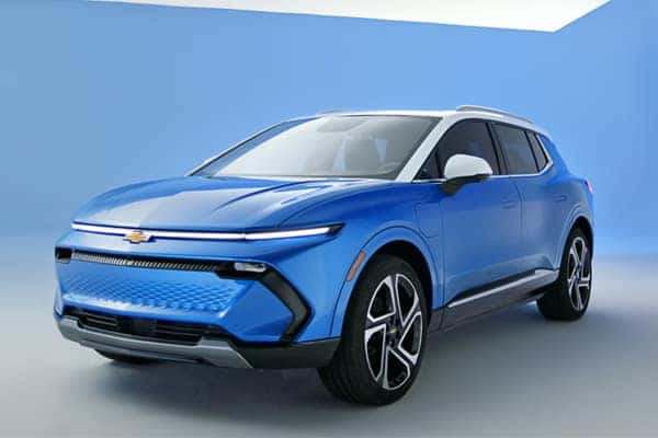 A bright blue SUV is displayed against a light blue background. The car has a sleek, modern design with a distinctive front grille and black wheel rims. The Chevrolet logo is visible on the front.