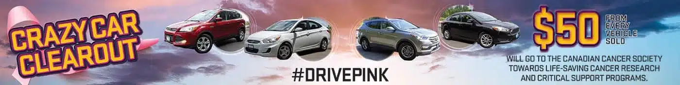 Crazy Car Clearout banner featuring various cars, supporting cancer research with #DrivePink initiative.