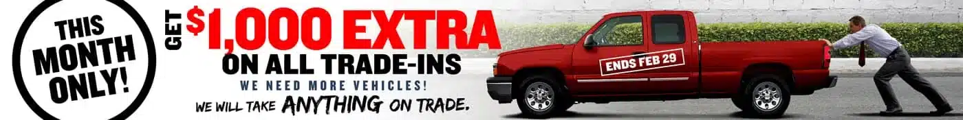 $1,000 extra trade-in offer on vehicles, valid this month only. Ends Feb 29. Urgent car trade promotion.
