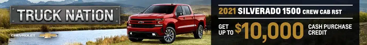 Red 2021 Chevrolet Silverado 1500 truck offer with up to $10,000 cash credit against a scenic mountain backdrop.
