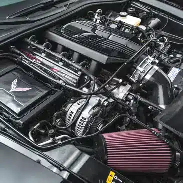 High-performance Corvette engine with detailed components, showcasing advanced automotive engineering.
