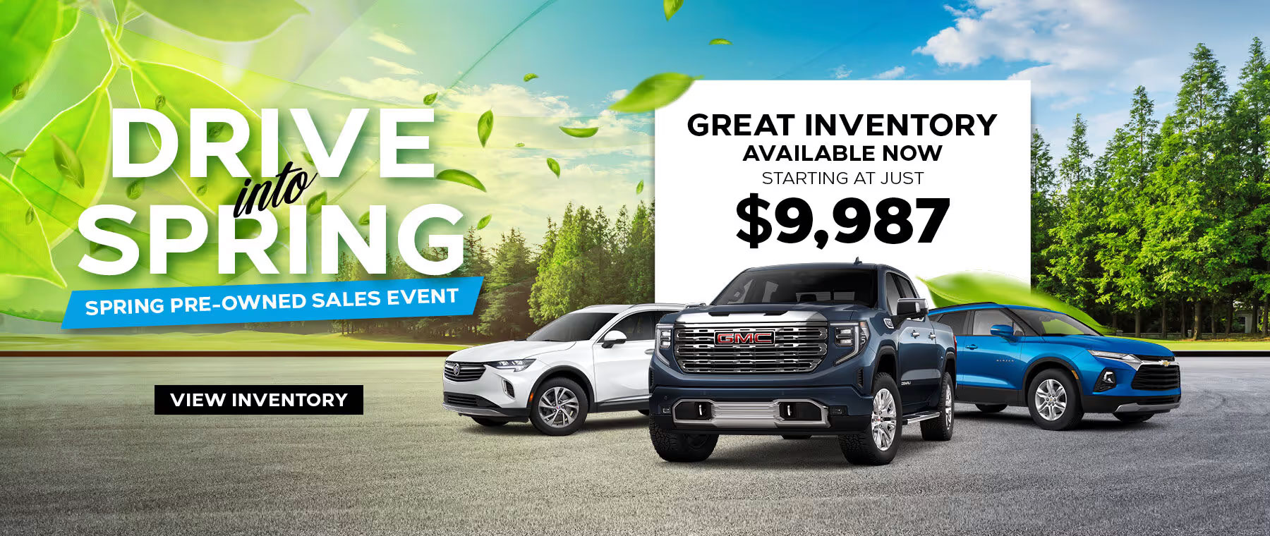 Advertisement for a car sales event titled Drive into Spring featuring three vehicles on a road, with trees and leaves in the background. A sign highlights Great Inventory Available Now! Starting at just $19,921. Button reads View Inventory.