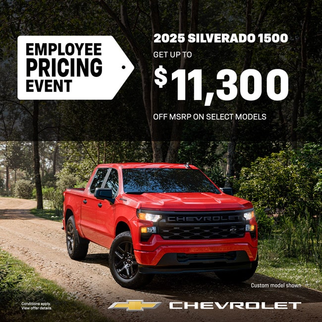 Red Chevrolet Silverado 1500 on a forest road, offering up to $11,300 off MSRP in Employee Pricing Event.