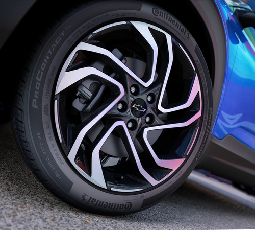 Close-up of a Chevrolet wheel with a Continental ProContact tire, showcasing its modern alloy design.